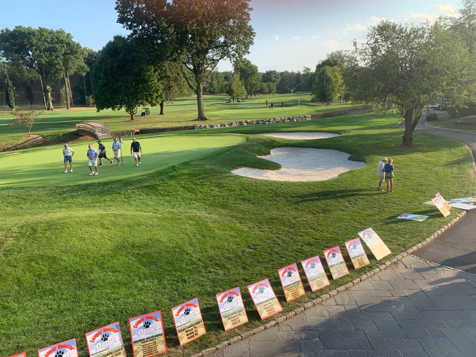 Cougar Booster golf outing 2022 legacy signs and perspective view of course